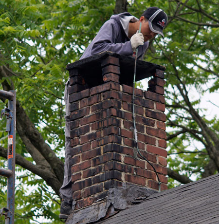 Guardian Chimney Sweep Macon Expert Working on a Chimney